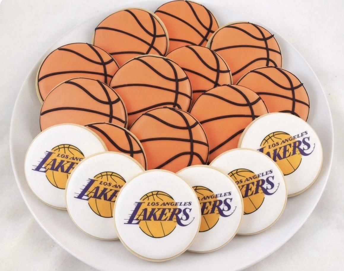 12 Lakers basketball cookies featuring a mix of basketball and Lakers-inspired designs, perfect for game days, birthdays, and sports celebrations.