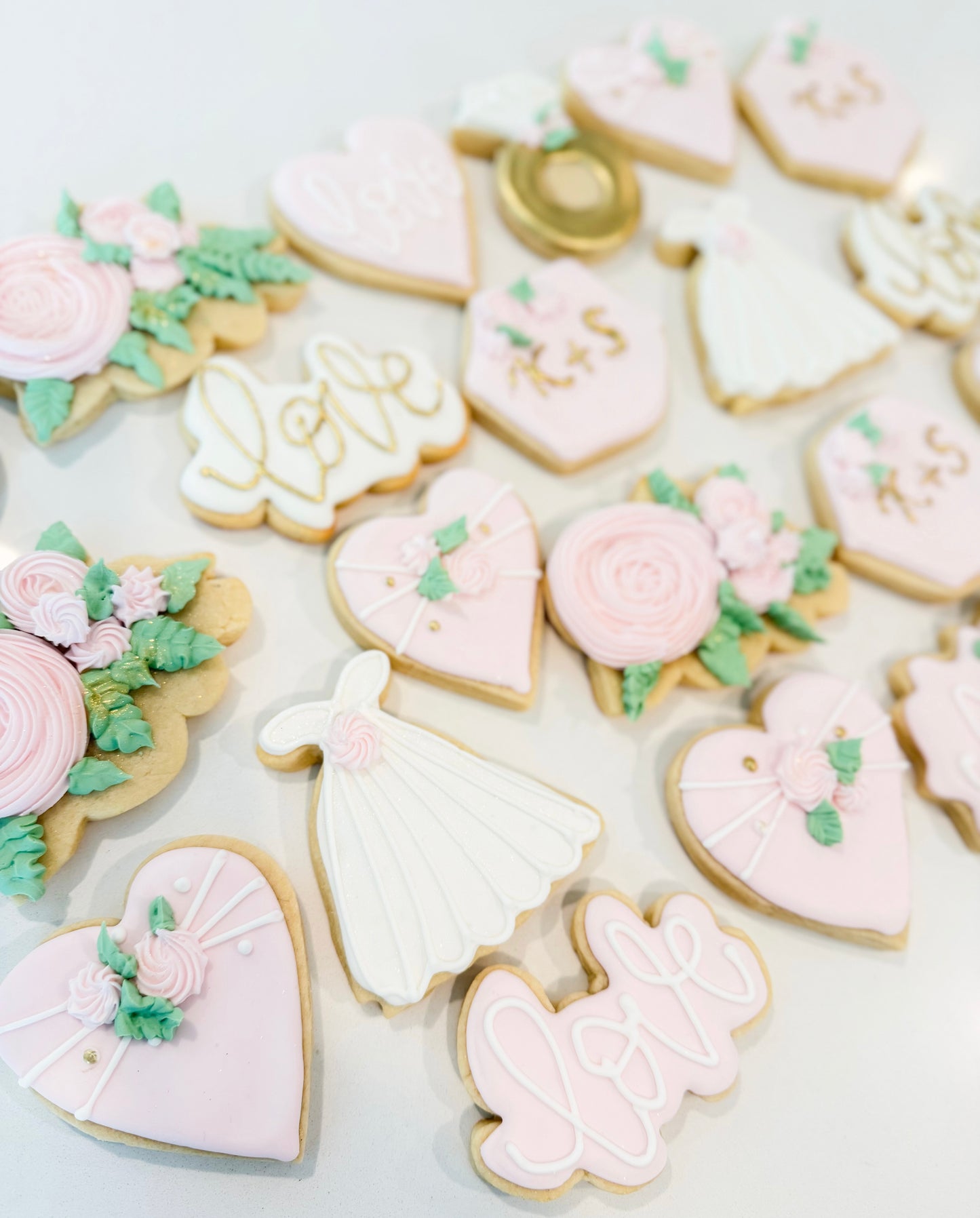 Decorated sugar cookie favors for bridal showers, bridesmaid gifts, and wedding celebrations.