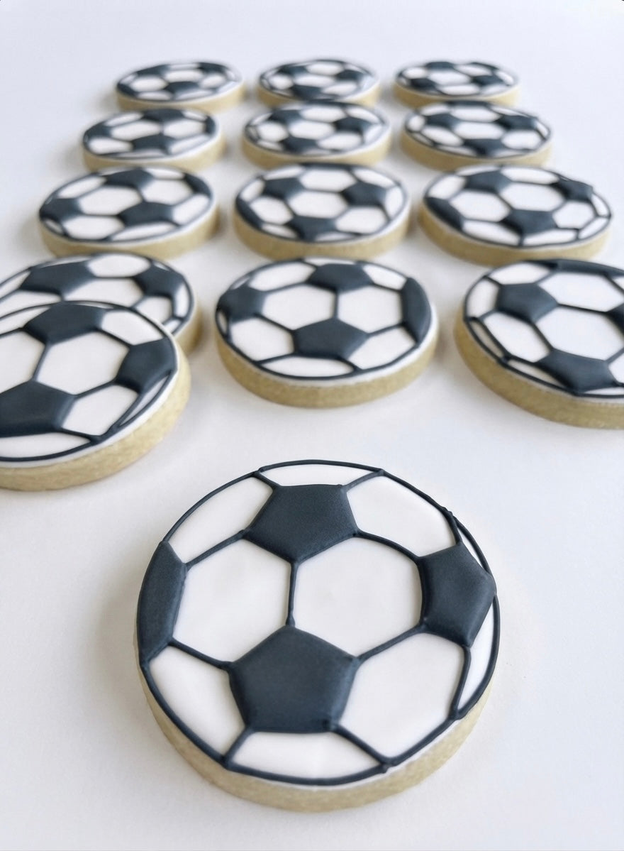 12 handmade soccer ball cookies decorated with soccer-themed designs, perfect for soccer birthdays, team parties, tournaments, and sports celebrations.

Soccer ball cookies 12 count for soccer birthdays, team celebrations, and sports parties.
Hand decorated soccer cookies with classic soccer ball designs for sports events and party favors.
Custom soccer ball sugar cookies for soccer players, teams, birthdays, and tournaments.
12 decorated soccer ball cookies arranged for a soccer